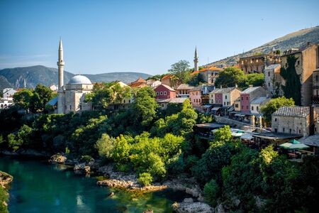 Beautiful view on Mostar city with Neretva river and ancient architecture from old bridge in Bosnia and Herzegovinaの写真素材