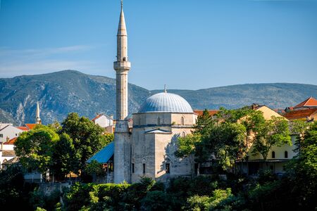 View on mosque from the old bridge in Mostar cityの写真素材
