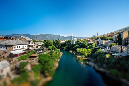 Beautiful view on Mostar city with Neretva river and ancient architecture from old bridge in Bosnia and Herzegovinaの写真素材
