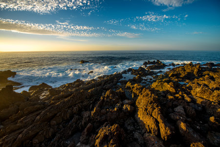 Rocky coast with splashing water on Tenerife island in Spain