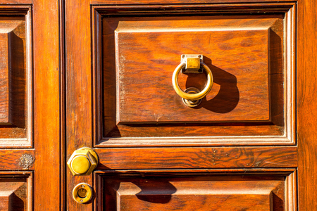 Close up view on old style handle on the wooden door in typical Spanish city on Tenerife islandの写真素材
