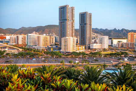 Santa Cruz cityscape view on residential buildings and offices with park and mountains on the sunrise, Canary islands, Spainの写真素材