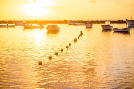 Fishing boats on Teresitas beach on the sunrise on Tenerife island, Spainの写真素材