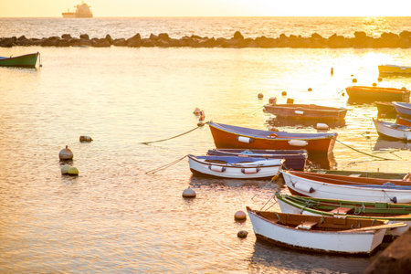 Fishing boats on Teresitas beach on the sunrise on Tenerife island, Spain