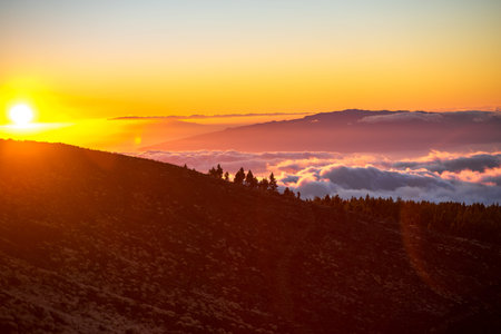 Beautiful landscape view on La Gomera island from Tenerife island above the clouds on the sunset.の写真素材
