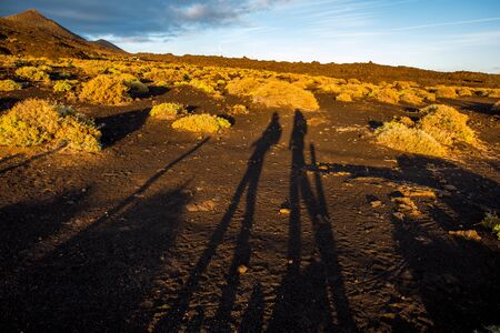 Volcanic landscape with people shadows in fuencaliente municipality on the south of La Palma island in Spainの写真素材