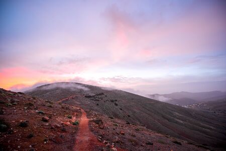 Beautiful morning landscape with burning sky and mountain on the central part of Fuerteventura island in Spainの写真素材