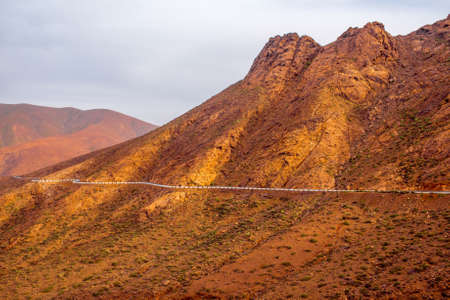 Mountain landscape at the central part of Fuerteventura island on the cloudy and foggy weather in Spainの写真素材