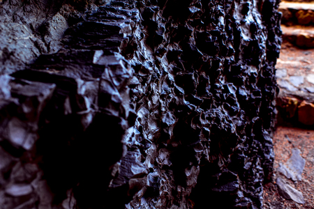Close-up view on volcanic black rock in Ajiy caves on Fuerteventura islandの写真素材