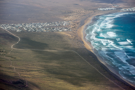 Top view on Famara coastline on the northern part of Lanzarote island in Spainの写真素材