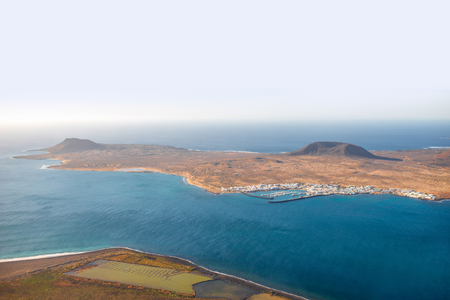 Top view on Graciosa island from El Rio viewpoint on Lanzarote island in Spainの写真素材