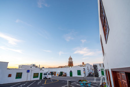 Central square with old church tower in Teguise village on the sunset on lanzarote island. Wide...