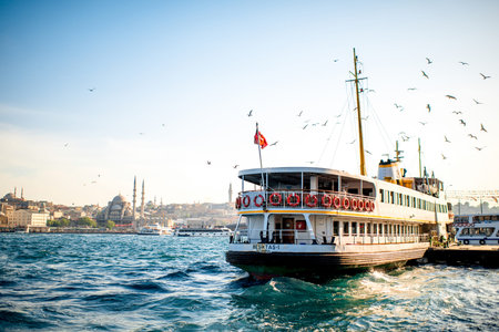 ISTANBUL -€“ MAY 28, 2015: Ferry full with tourists floats on Bosphorus waterway in Istanbul on...
