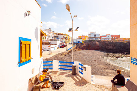 EL COTILLO, FUERTEVENTURA ISLAND, SPAIN - SIRCA JANUARY 2016: City street view with musicians...