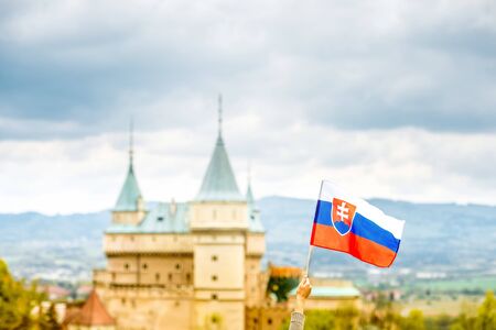 Bojnice castle with slovak flag in Slovakiaの写真素材