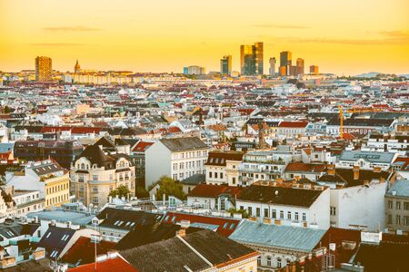 Panoramic cityscape view on Vienna city with Wienerburg modern offices on the horizon on the sunset in Austriaの写真素材