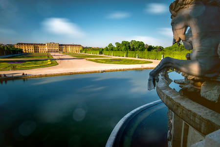 VIENNA, AUSTRIA - CIRCA APRIL 2016: Schonbrunn palace with fountain. This palace is one of the most important historical places in Austria. Long exposur technic with glossy water and blurred cloudsのeditorial素材