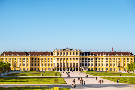 VIENNA, AUSTRIA - CIRCA APRIL 2016: Schonbrunn palace with tourist walk on the alley in Vienna. This Palace is one of the most important architectural and historical monuments in the Austriaのeditorial素材