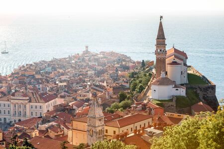 Aerial city scape view on Piran town with church tower and Adriatic sea on the background in Sloveniaの写真素材