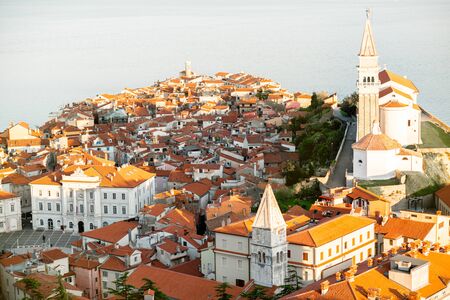 Aerial city scape view on Piran town with church tower and Adriatic sea on the background in Sloveniaの写真素材