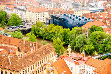 Graz, Austria - Augusts 3, 2016: Aerial view on graz city with modern building of art gallery named Kunsthaus. Kunsthaus is famous architectural landmark in Grazのeditorial素材
