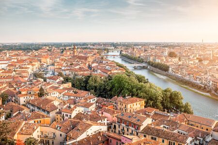 Panoramic aerial view on the eastern part of Verona old town from the castle hill on the sunsetの写真素材