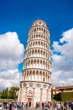 Pisa, Italy - June 02, 2016: Tourists near the leaning tower in Pisa. This tower is the bell tower of the cathedral and is famous for its unintended tilt.のeditorial素材