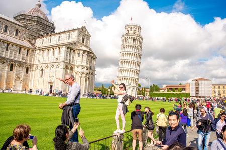 Pisa, Italy - June 02, 2016: Tourists near Pisa tower and cathedral on the field of Miracles in Pisa town in Italyのeditorial素材