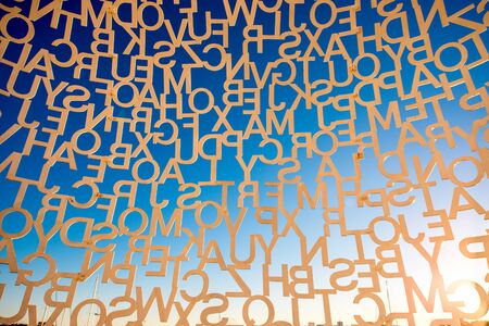 Antibes, France - June 14, 2016: Letters on the sky background. Fragment of the sculpture called Nomade in Antibes village. This sculpture is a creation by contemporary Catalan artist Jaume Plensaのeditorial素材