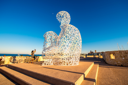 Antibes, France - June 14, 2016: Nomade, A Man of Letters Looking Out Over The Mediterranean in Antibes village. This sculpture is a creation by contemporary Catalan artist Jaume Plensaのeditorial素材