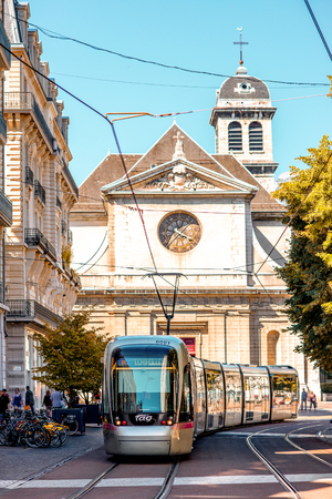 Grenoble, France - June 21, 2016: City street view with Saint Louis church and tram in Grenoble city in Franceのeditorial素材