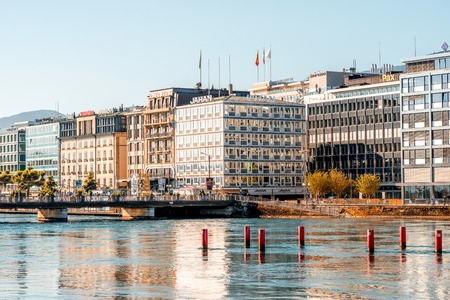 Geneva, Switzerland - June 23, 2016: Riverside buildings with offices of famous brands in the center of Geneva city. Geneva is a financial center and worldwide center for diplomacy in Europeのeditorial素材