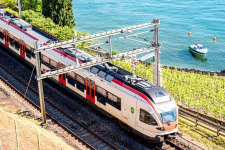 Geneva, Switzerland - June 23, 2016: High-speed Swiss train on the railway near Geneva lake. Railway...