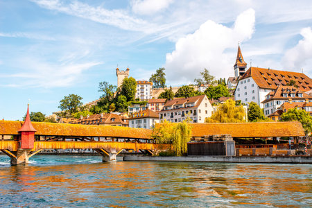 Cityscape view on the old wooden bridge and a riverside in Lucerne old town in Switzerland