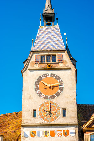 Close-up view on the clock tower in Zug town near Zurich city in Switzerland