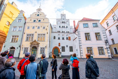 Riga, Latvia - September 22, 2016: View in the famous three brothers houses with group of tourists in the old town of Riga. It is the oldest complex of dwelling houses in Rigaのeditorial素材