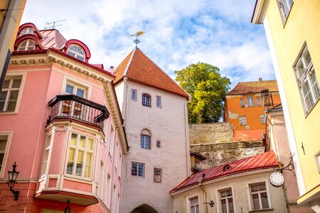 Street view with gate tower in the old town of Tallinn, Estoniaの写真素材