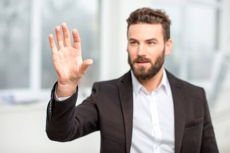 Man pointing on the virtual screenの写真素材