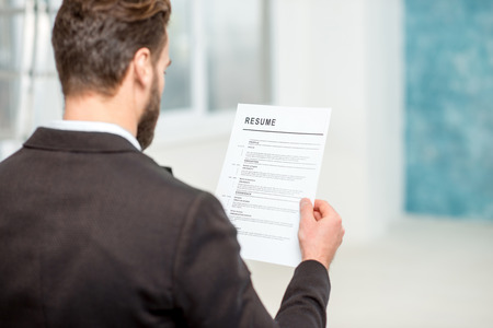 Recruiter with resume paperの写真素材