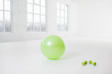 Fitness ball with dumbbellsの写真素材