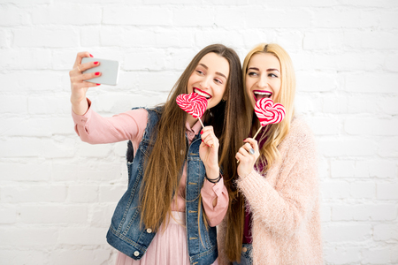 Friends making selfie photoの写真素材