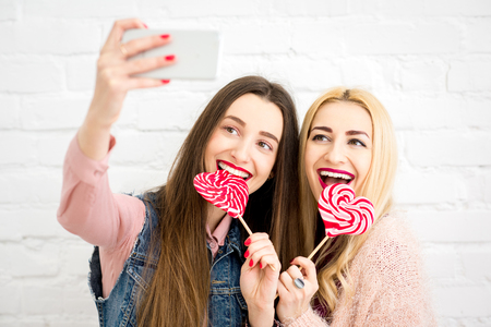 Friends making selfie photoの写真素材