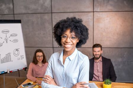 Womans portrait with coworkersの写真素材