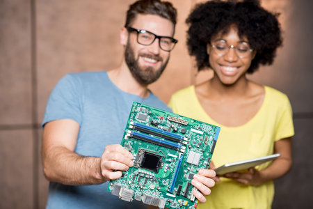 Programmers with computer motherboard