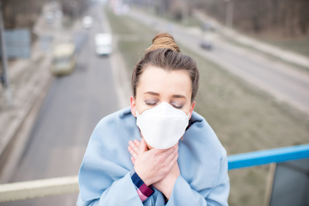 Woman with mask in the cityの写真素材