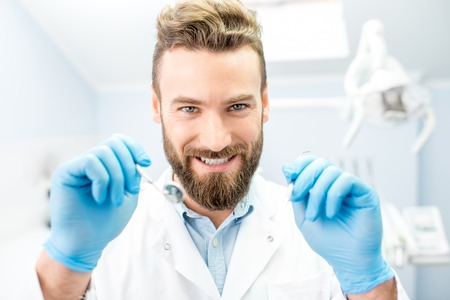 Scary dentist looking at the cameraの写真素材