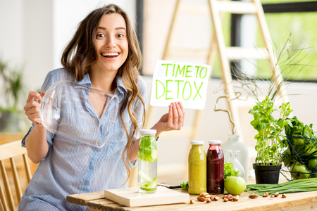 Woman with green healthy food at homeの写真素材