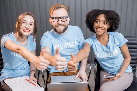 Happy volunteers indoorsの写真素材