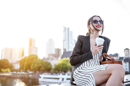 Businesswoman eating outdoorsの写真素材