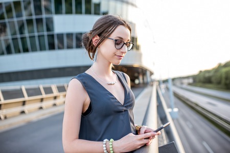 Businesswoman outdoors on the roadの写真素材